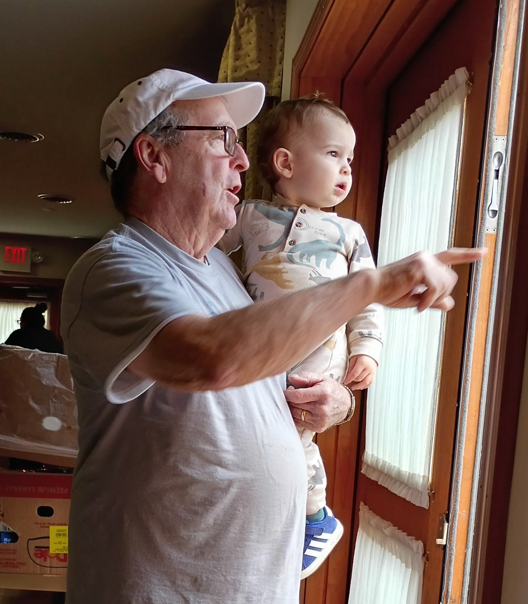 Volunteer Danny holding Honorary Volunteer Riley!